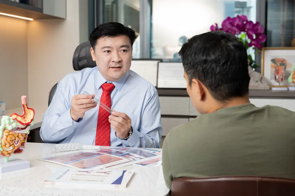 Dr Tay Jia Sheng explaining stent procedure
